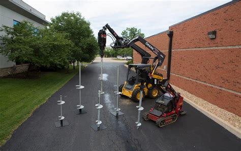 digging piers in tight spaces skid steer|helical pier installation equipment.